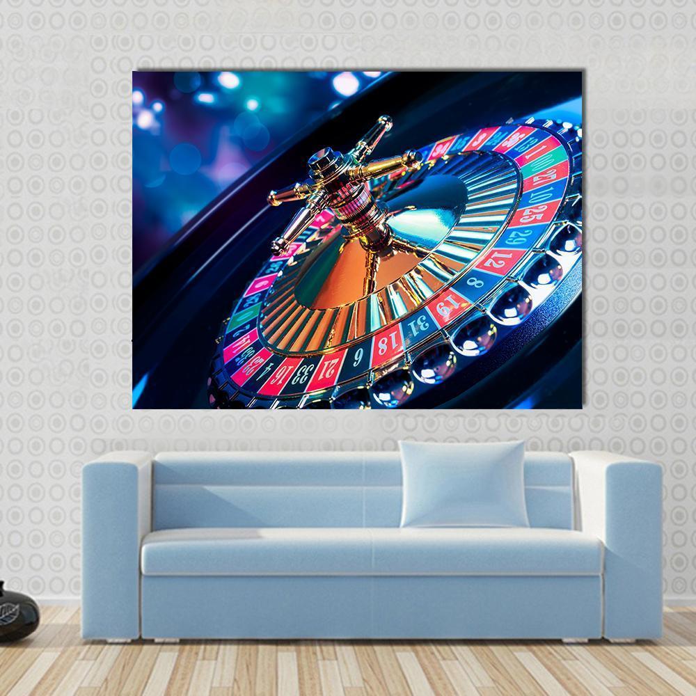 Casino Roulette Canvas Wall Art in black, gold and blue, single panel hung on a wall