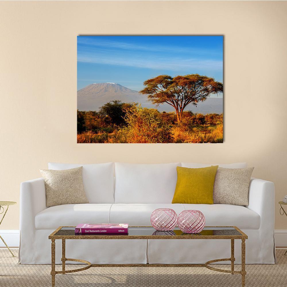 Kilimanjaro at Golden Hour Canvas Wall Art in gold, orange and blue, single panel hung on a wall