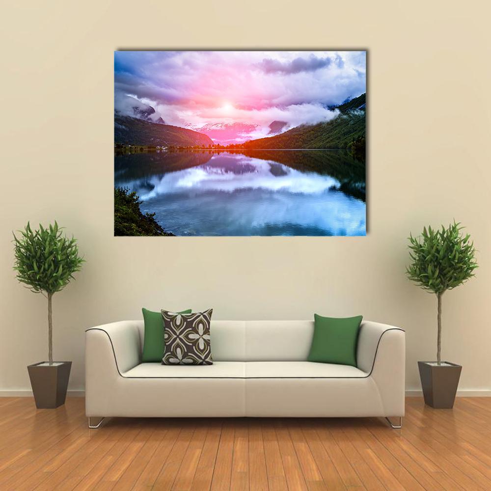 Norwegian Lake at Sunset Canvas Wall Art in orange, blue and pink, single panel hung on a wall
