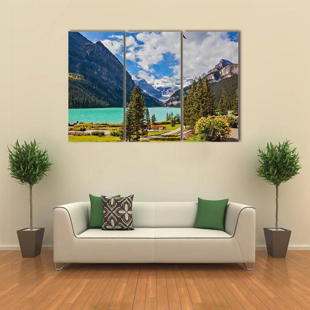 Serene Lake Louise Landscape Canvas Wall Art in white, green and blue, 3 panel horizontal set hung on a wall