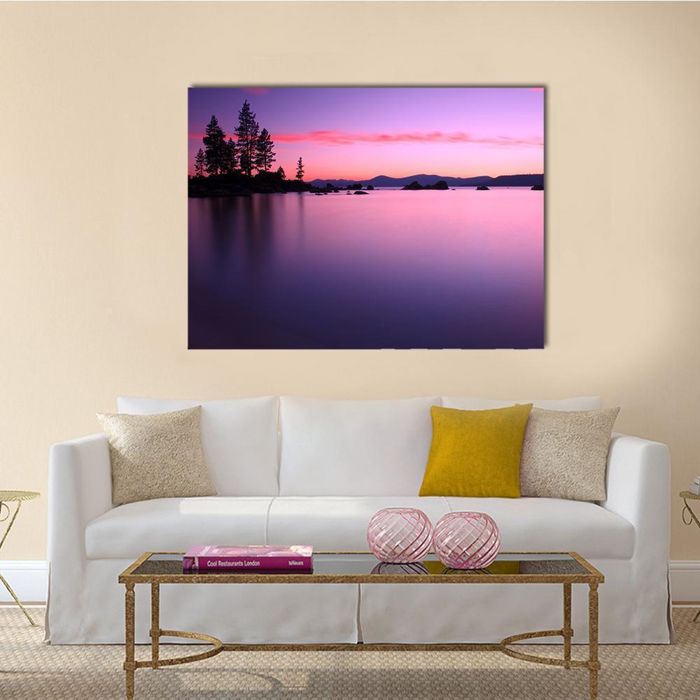 Lake Tahoe Sunset Reflection Canvas Wall Art in purple and pink, single panel hung on a wall