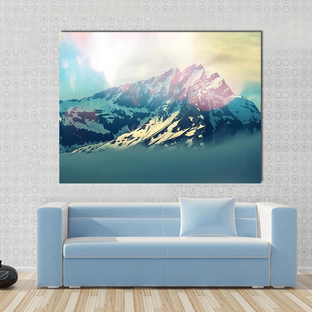 Majestic Mountain Peak in Bright Light Canvas Wall Art in white, yellow and blue, single panel hung on a wall