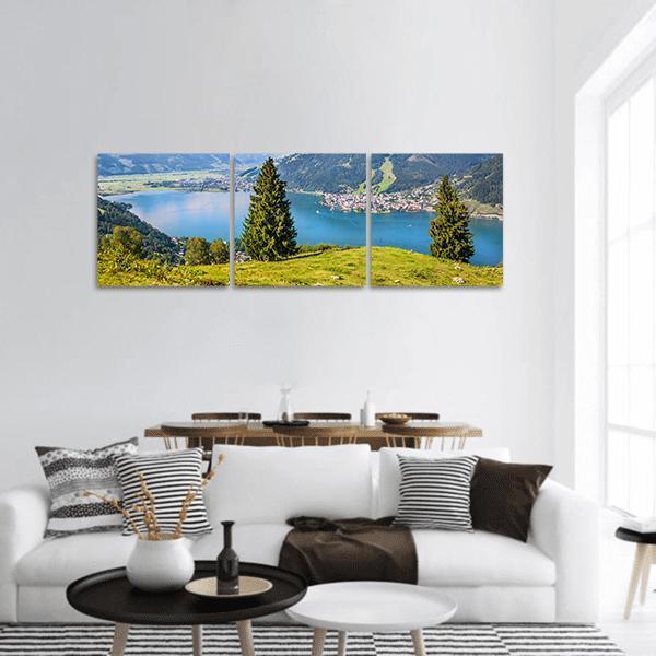 Salzburger Lake Village View Panoramic Canvas Wall Art in green and blue, hung on a wall