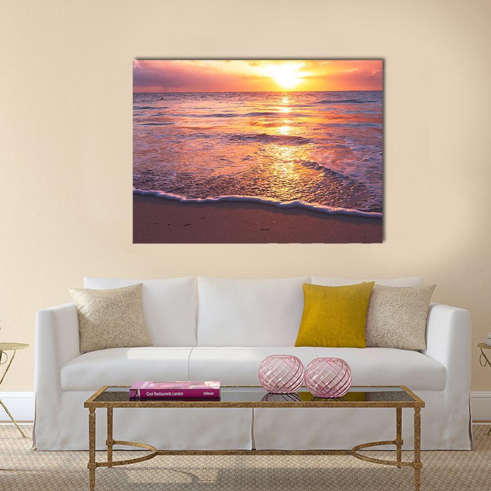 Beautiful Sea Sunset Canvas Wall Art in orange, purple and pink, single panel hung on a wall