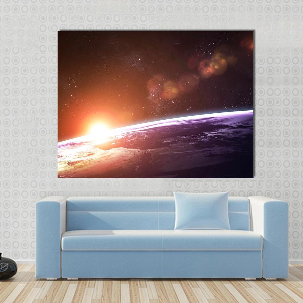 Sunset on Planet Earth Canvas Wall Art in black, orange and purple, single panel hung on a wall