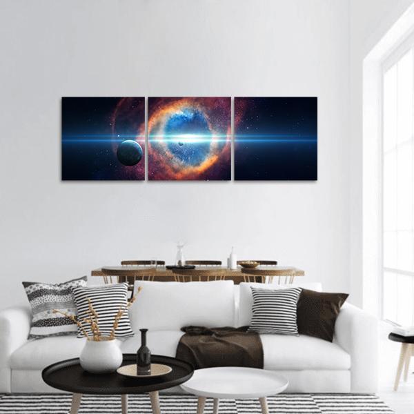 Cosmic Ring Nebula with Light Beam Panoramic Canvas Wall Art in black, orange and blue, hung on a wall