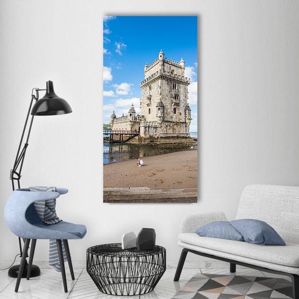 Belém Tower Portugal Vertical Canvas Wall Art in gray, beige and blue, single vertical panel hung on a wall