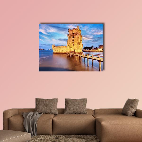 Belem Tower at Twilight Canvas Wall Art in orange, yellow and blue, single panel hung on a wall