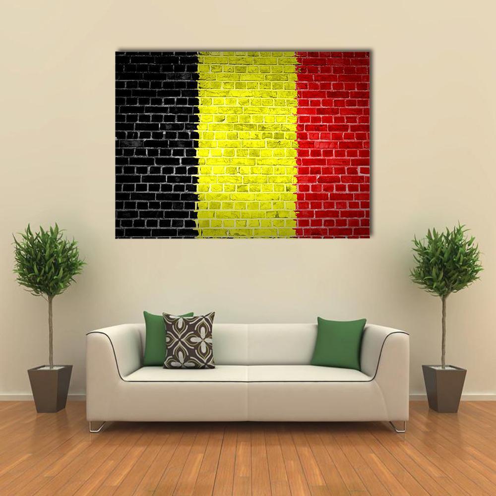 Belgium Flag on Brick Canvas Wall Art in black, red and yellow, single panel hung on a wall