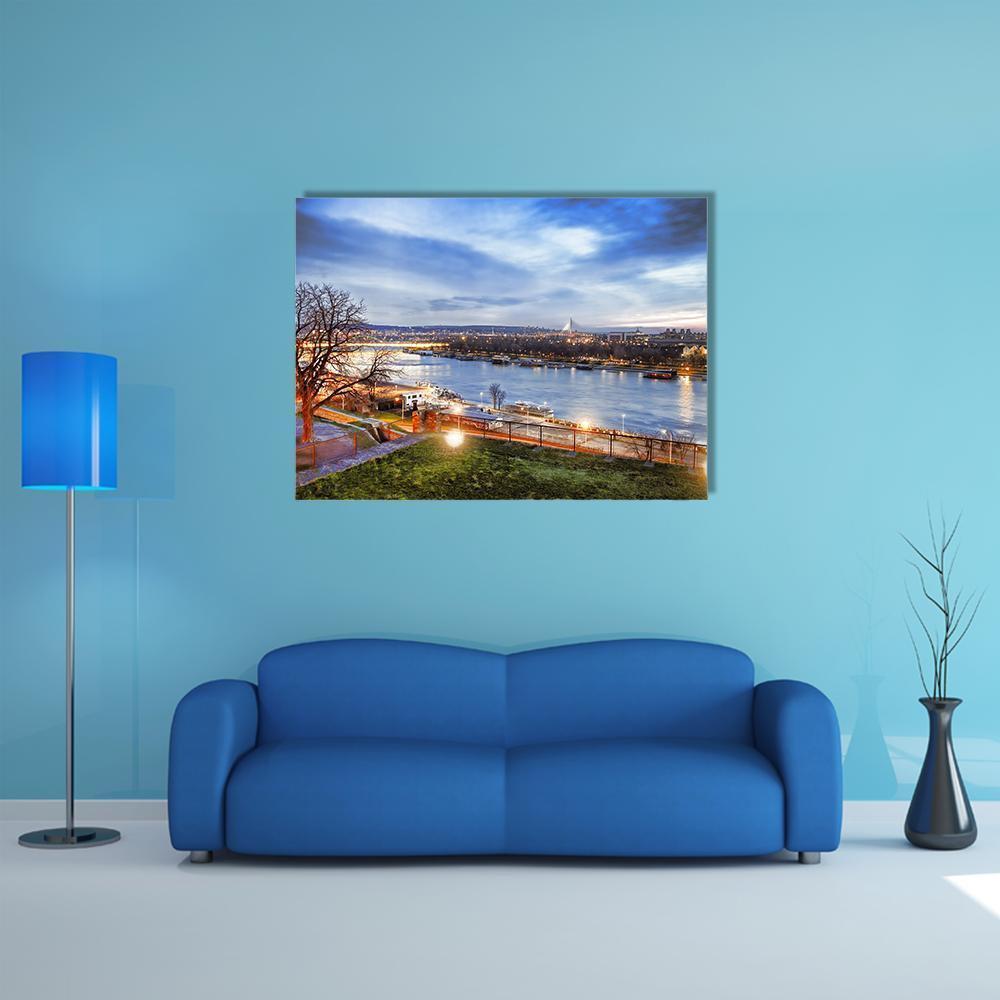 Belgrade Dusk River Reflections Canvas Wall Art in gray, orange and blue, single panel hung on a wall