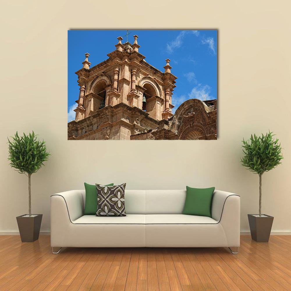 Bell Tower of Puno Canvas Wall Art in beige, brown and blue, single panel hung on a wall