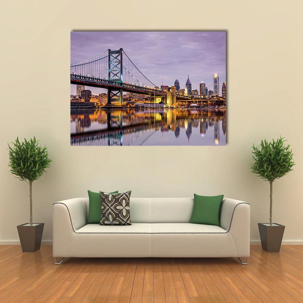 Ben Franklin Bridge Night Reflection Canvas Wall Art in yellow, blue and purple, single panel hung on a wall