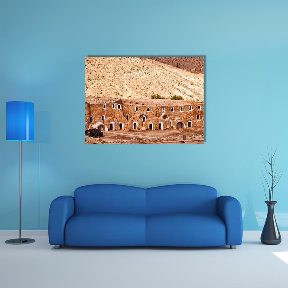 Berber Dwelling Matmata Canvas Wall Art in beige and brown, single panel hung on a wall