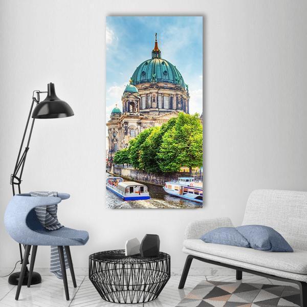 Berlin Cathedral on the Spree River Vertical Canvas Wall Art in beige, green and blue, single vertical panel hung on a wall