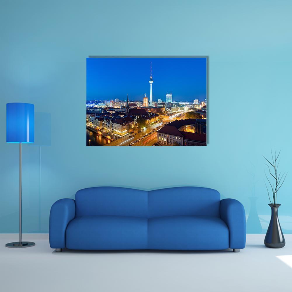 Berlin Night Skyline Over Spree River Canvas Wall Art in black, yellow and blue, single panel hung on a wall
