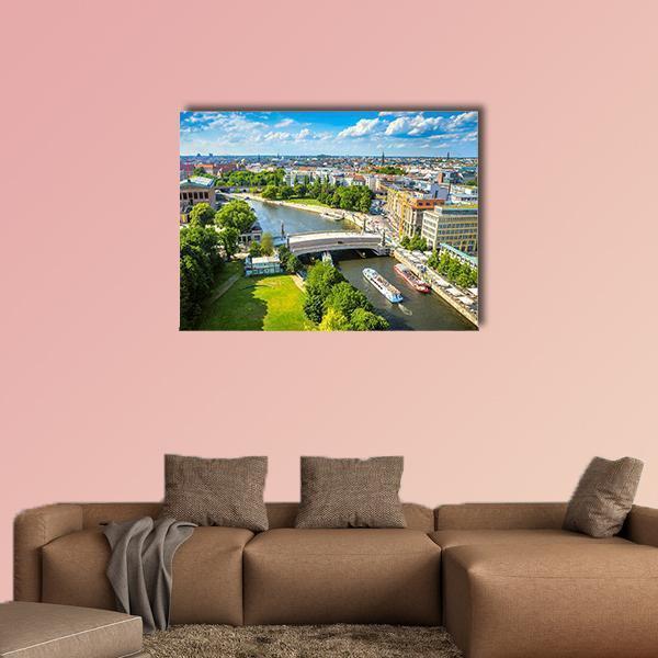 Berlin City View on the River Spree Canvas Wall Art in green and blue, single panel hung on a wall