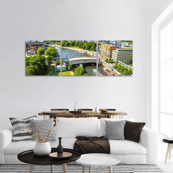 Berlin Potsdam Riverfront Panoramic Canvas Wall Art in gray, green and blue, hung on a wall
