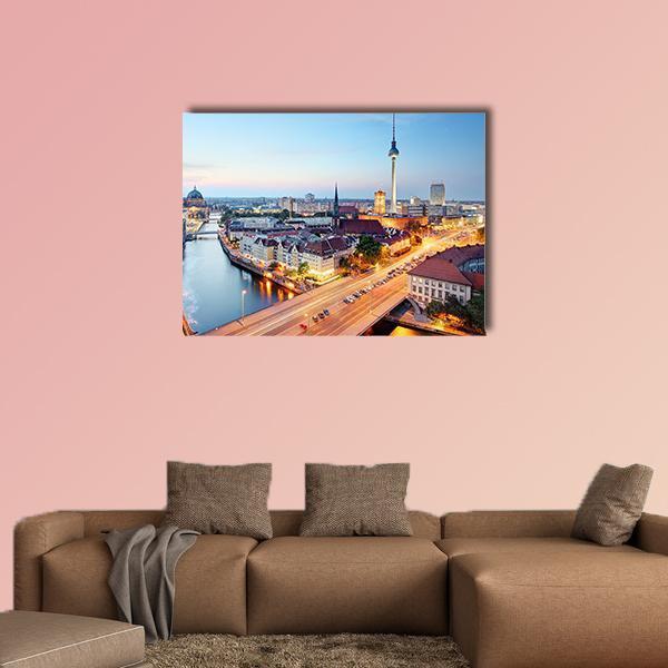 Berlin Skyline with Fernsehturm at Dusk Canvas Wall Art in orange, yellow and blue, single panel hung on a wall