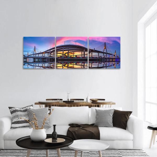 Bhumibol Bridge at Twilight Panoramic Canvas Wall Art in orange, blue and purple, hung on a wall