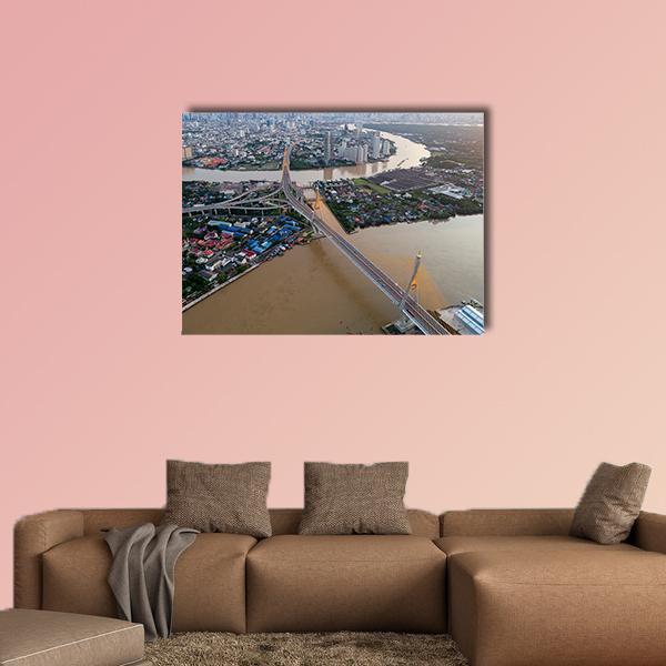 Bhumibol Bridge Over Winding River Canvas Wall Art in gray, brown and blue, single panel hung on a wall