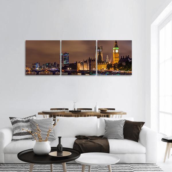 Westminster Bridge at Night Panoramic Canvas Wall Art in black, brown and yellow, hung on a wall