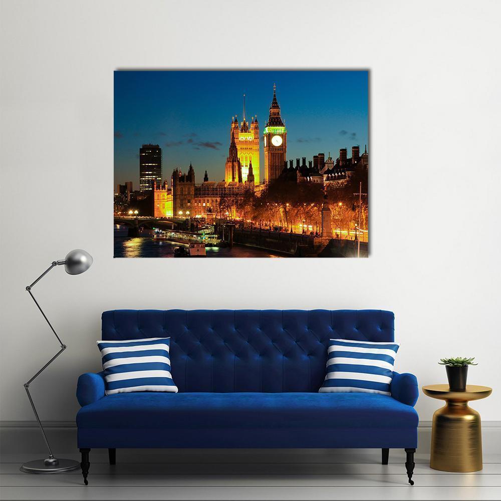Big Ben and Westminster Bridge at Night Canvas Wall Art in gold, yellow and blue, single panel hung on a wall