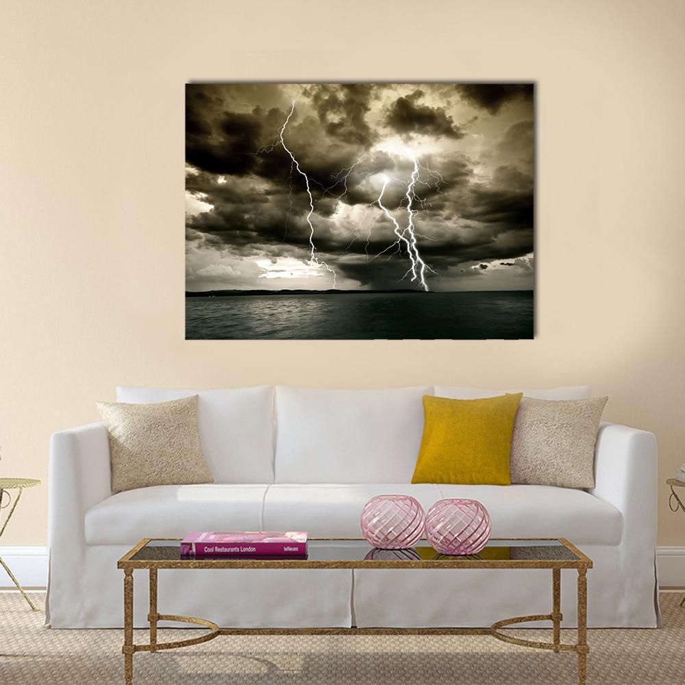 Dramatic Lightning Storm Over Ocean Canvas Wall Art in black, white and gray, single panel hung on a wall