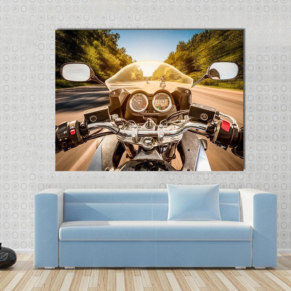 Biker Driving a Motorcycle Canvas Wall Art in black, brown and blue, single panel hung on a wall