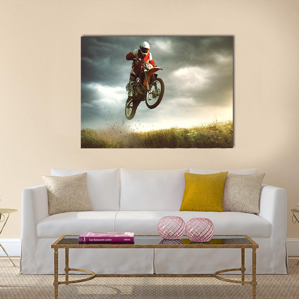 Motocross Rider Mid-air Jump Canvas Wall Art in black, gray and orange, single panel hung on a wall