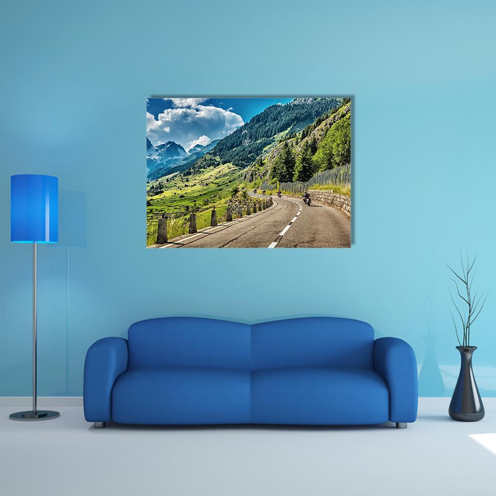 Group of Motorcyclists on Mountain Road Canvas Wall Art in gray, green and blue, single panel hung on a wall