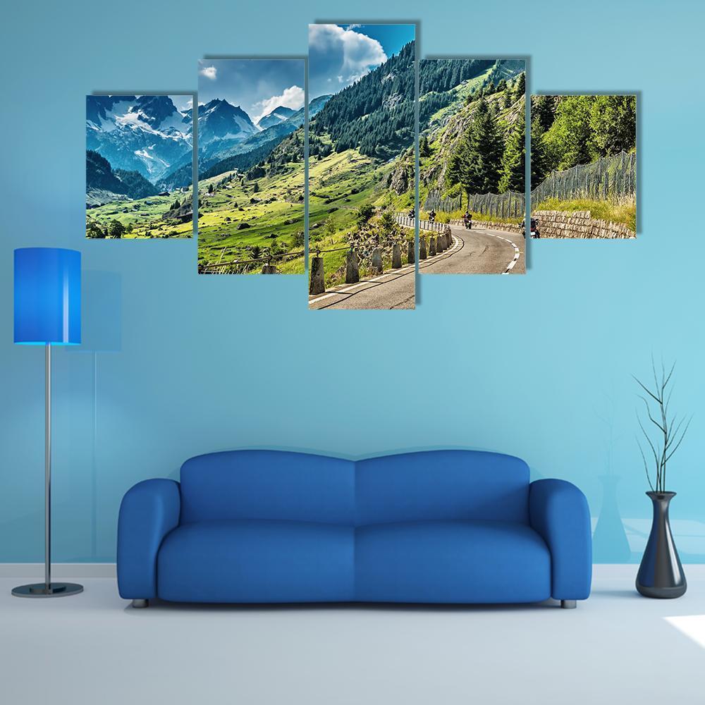 Group of Motorcyclists on Mountain Road Canvas Wall Art in gray, green and blue, 5 panel Star layout hung on a wall