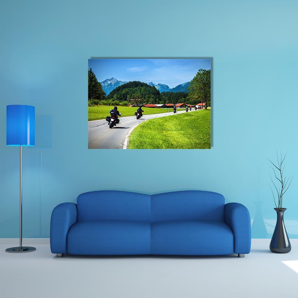 Bikers on Mountainous Road Canvas Wall Art in gray, green and blue, single panel hung on a wall