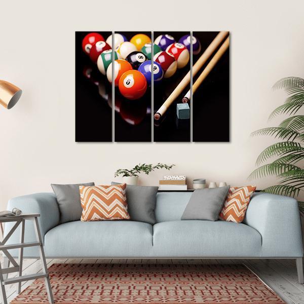 Snooker Balls, Cues, and Chalk Canvas Wall Art in black and multicolor, hung on a wall