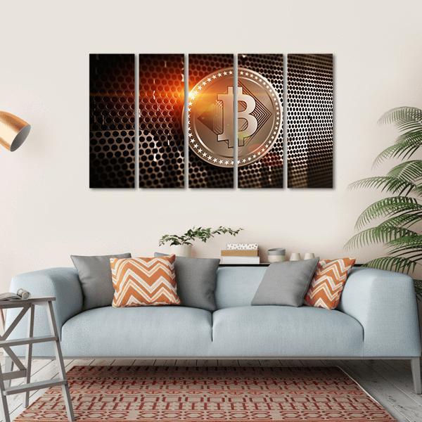 Bronze Bitcoin on Perforated Metal Sheet Canvas Wall Art in black and orange, hung on a wall