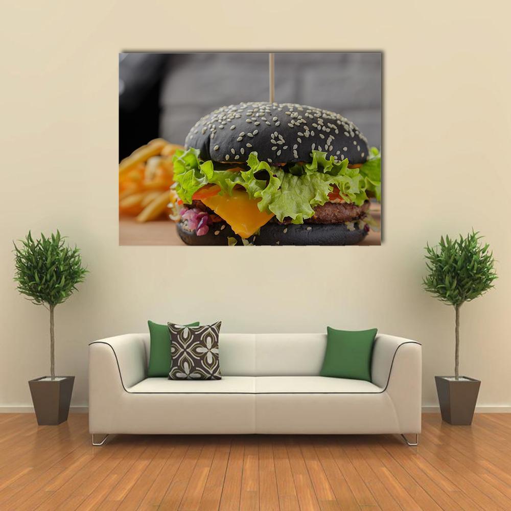 Black Sesame Burger with Fries Canvas Wall Art in black, gray and green, single panel hung on a wall