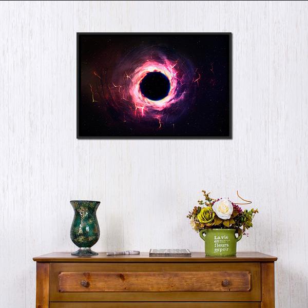 Black Hole Illustration Canvas Wall Art in black, purple and pink, framed canvas, product view on a white background