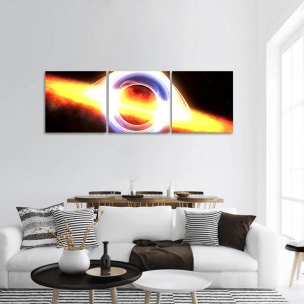 Black Hole with Glowing Accretion Disk Panoramic Canvas Wall Art in black, orange and yellow, hung on a wall