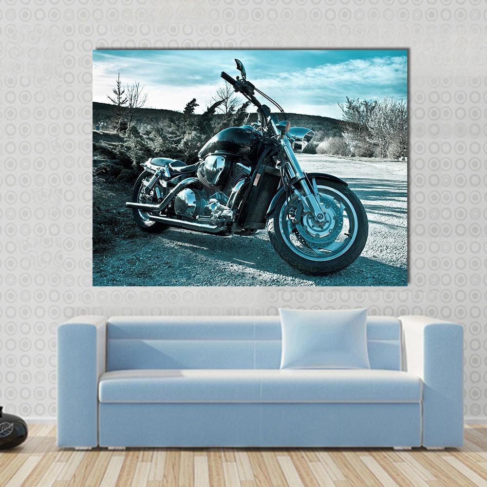 Black Chopper Motorcycle Canvas Wall Art in black, silver and blue, single panel hung on a wall