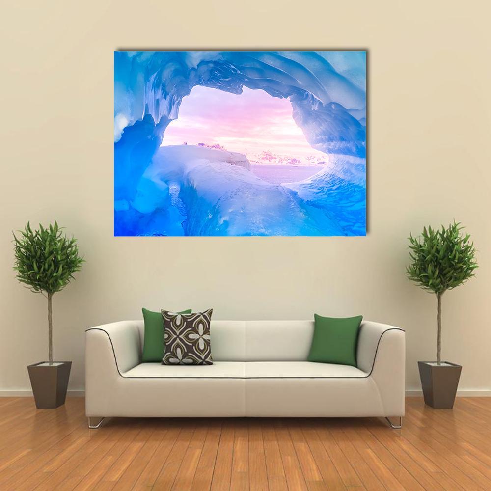 Serene Blue Ice Cave at Sunset Canvas Wall Art in white, blue and pink, single panel hung on a wall