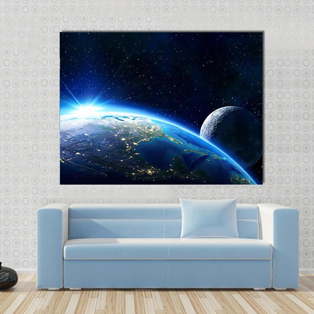 Blue Planet Earth and Moon Canvas Wall Art in black and blue, single panel hung on a wall