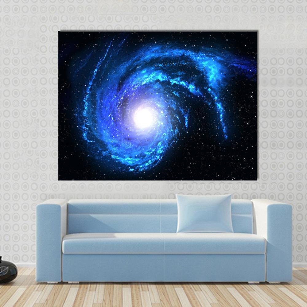 Blue Spiral Galaxy Canvas Wall Art in black, white and blue, single panel hung on a wall