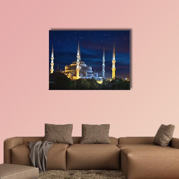 Sultanahmet Mosque at Night Canvas Wall Art in yellow, blue and navy, single panel hung on a wall