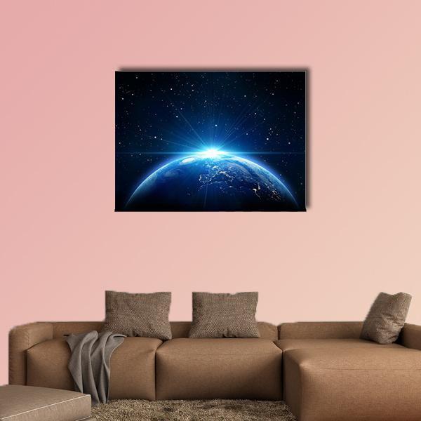 Sunrise Over Earth from Space Canvas Wall Art in black and blue, single panel hung on a wall