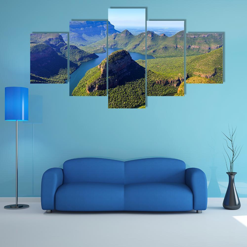 Blyde River Canyon Aerial View Canvas Wall Art in brown, green and blue, 5 panel Star layout hung on a wall