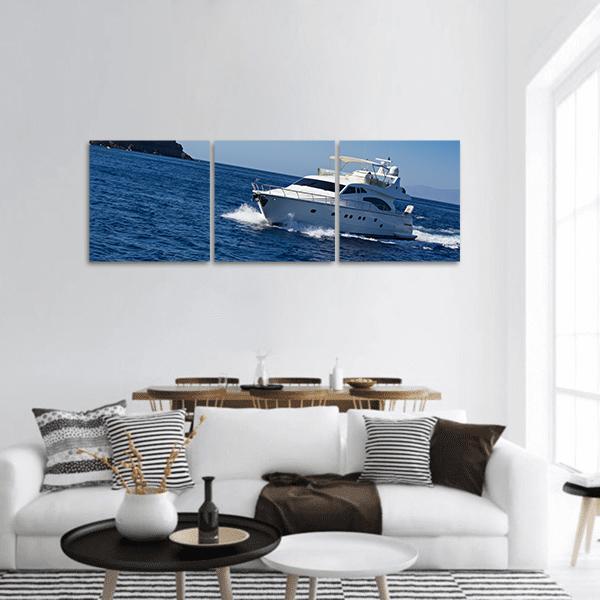 Motor Yacht in Deep Blue Water Panoramic Canvas Wall Art in white and blue, hung on a wall