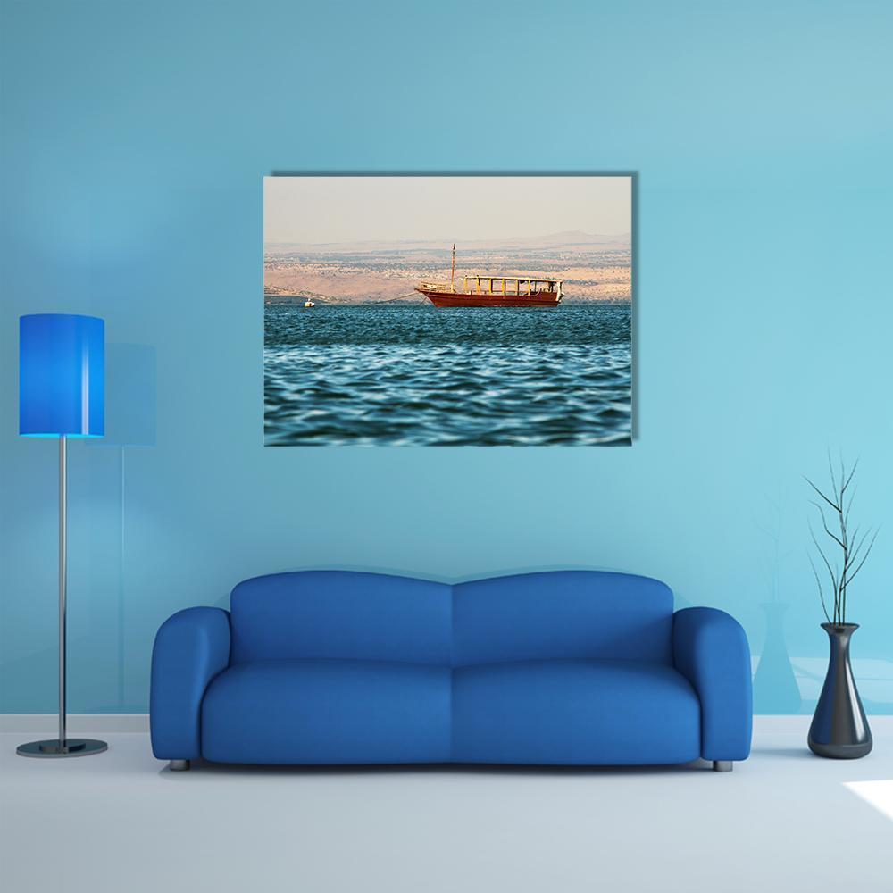 Wooden Boat on Calm Sea Canvas Wall Art in beige, brown and blue, single panel hung on a wall