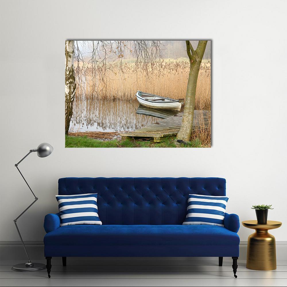 White Rowboat on Lake in Denmark Canvas Wall Art in gray, beige and brown, single panel hung on a wall