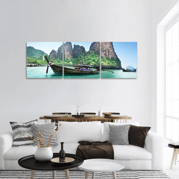 Thai Long-tail Boat at Railay Beach Panoramic Canvas Wall Art in brown, green and blue, hung on a wall