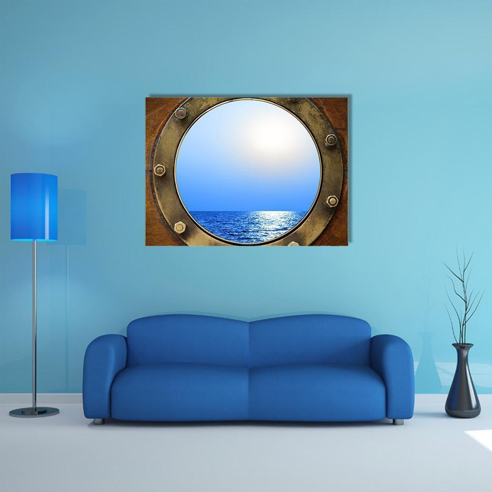 Porthole View of the Ocean Canvas Wall Art in brown and blue, single panel hung on a wall