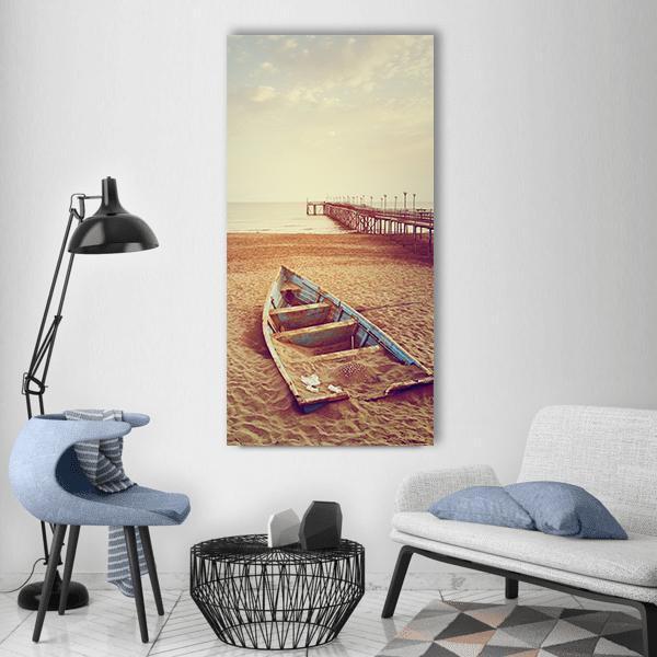 Partially Buried Boat by Wooden Pier Vertical Canvas Wall Art in beige, brown and blue, single vertical panel hung on a wall